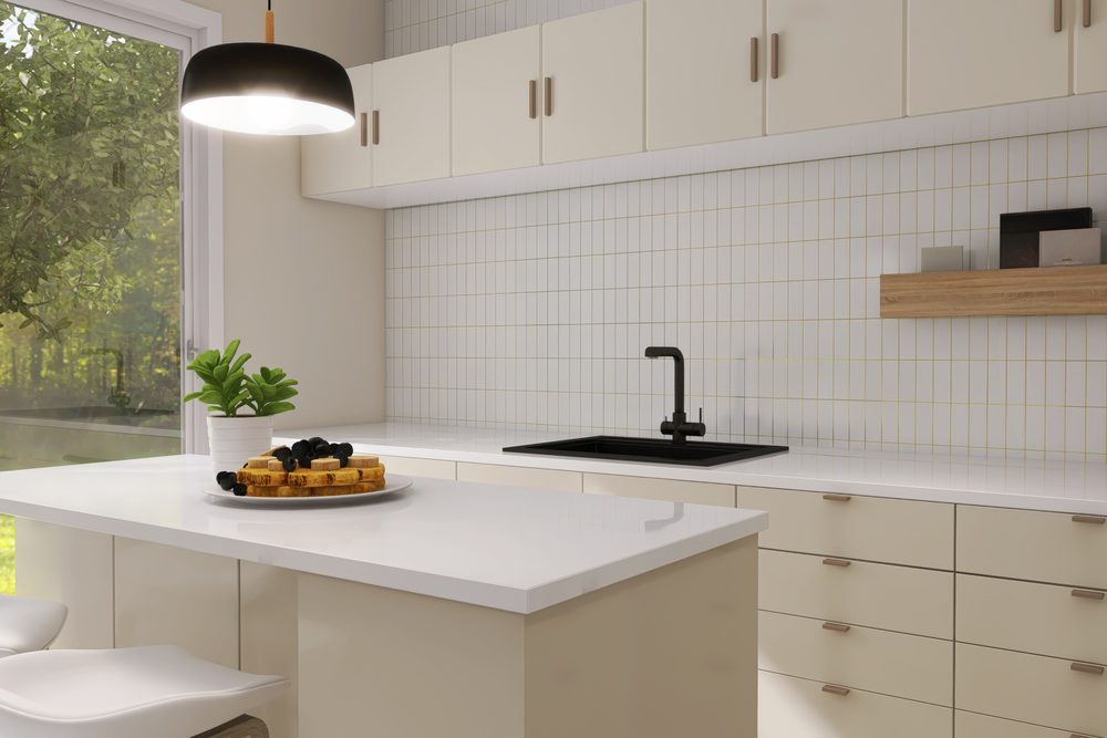 Open kitchen cupboard at night with a hand reaching for a box of cookies