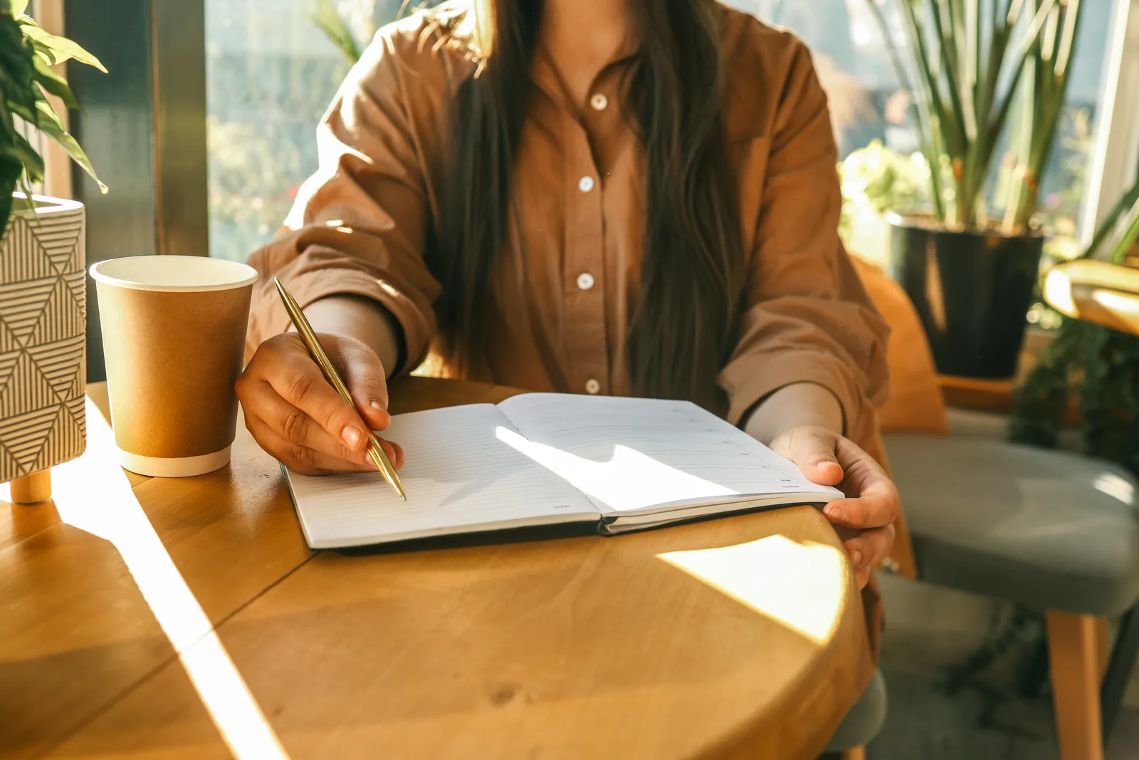 Public servant reviewing accommodation paperwork at an office desk in warm morning light, reflecting workplace supports available to federal employees with ADHD.