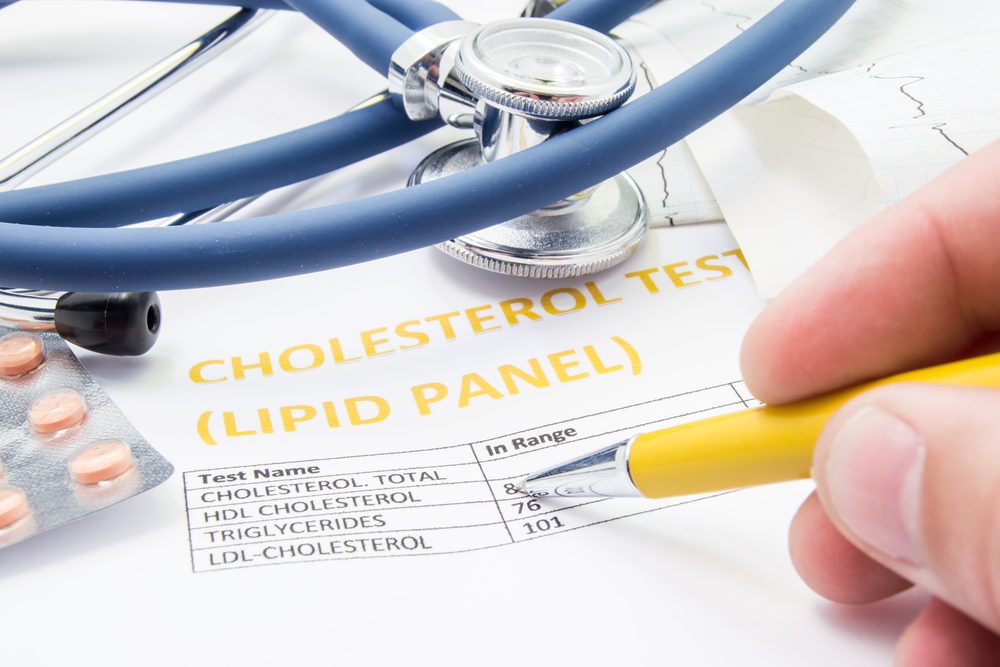 Blood test requisition form, a pen and a glass of water on a clinic counter